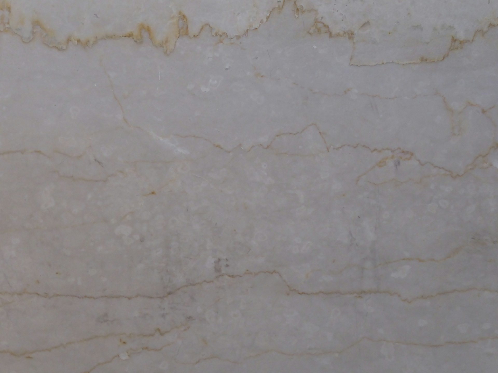 A close up of a white marble wall